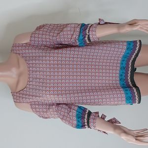 Umgee Small tunic with 3/4 sleeves and cut out shoulder